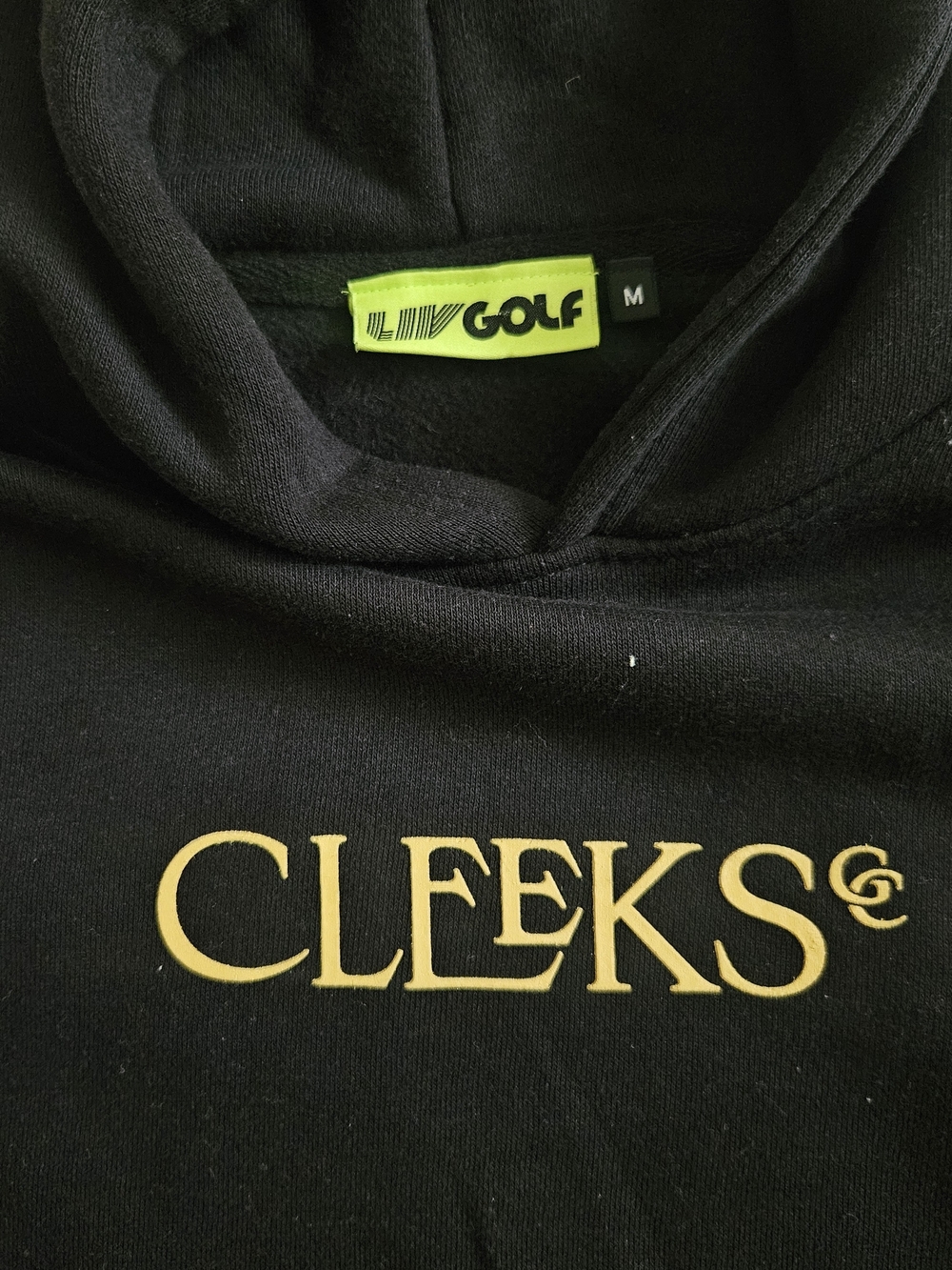 CLEEKS Black Hoodie with Gold Logo - LIV Golf Tag